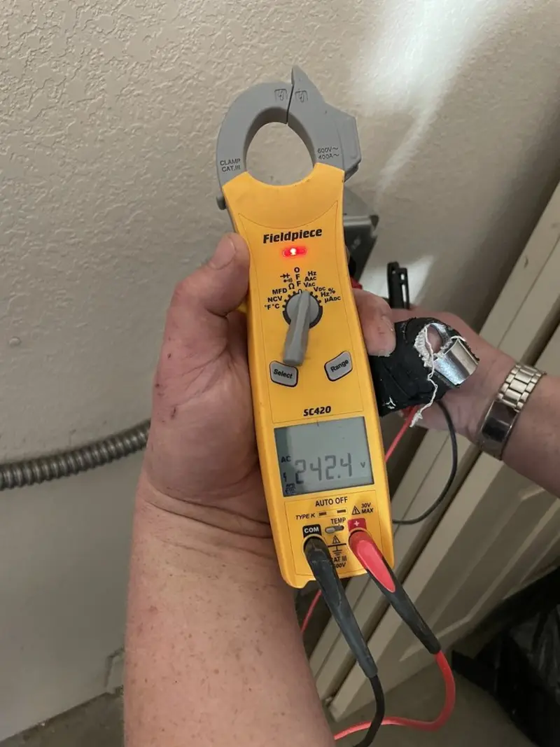 Voltage testing with clamp meter during Ceiling Fan Installation in Trenton